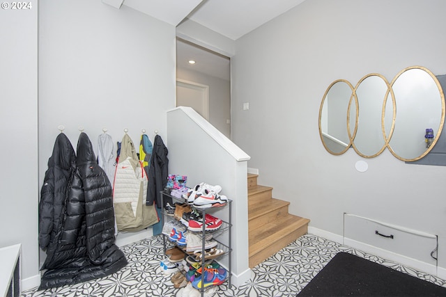 stairs featuring tile patterned flooring