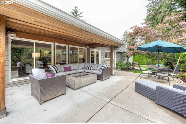 view of patio / terrace featuring an outdoor living space with a fire pit