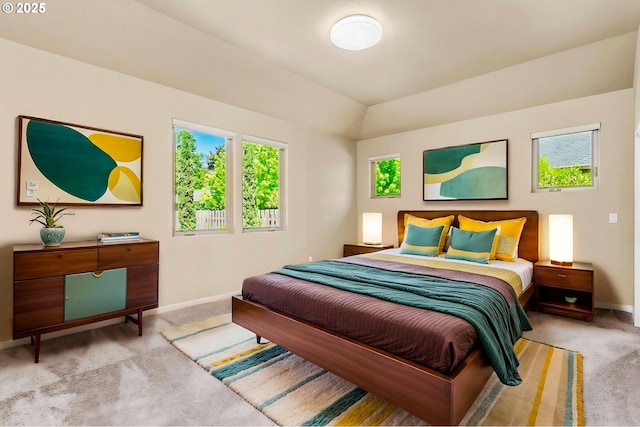 carpeted bedroom featuring baseboards