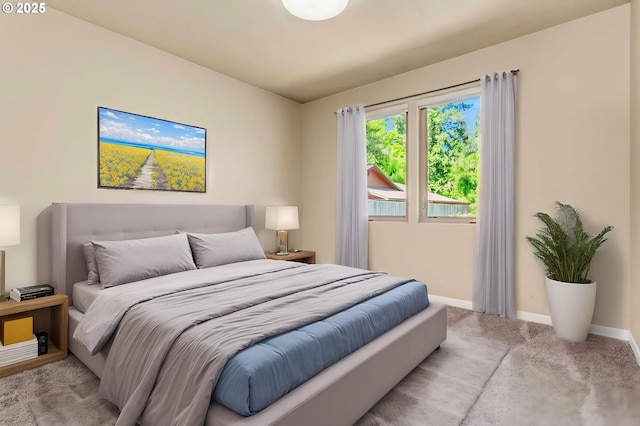 bedroom featuring carpet floors and baseboards