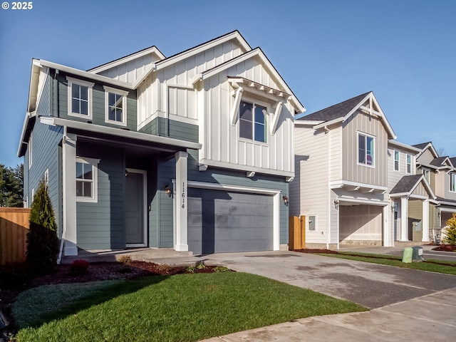 view of front of property featuring a garage and a front lawn