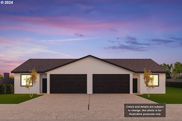 ranch-style house featuring a lawn and a garage