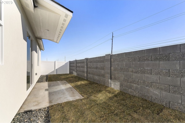 view of yard with a fenced backyard and a patio