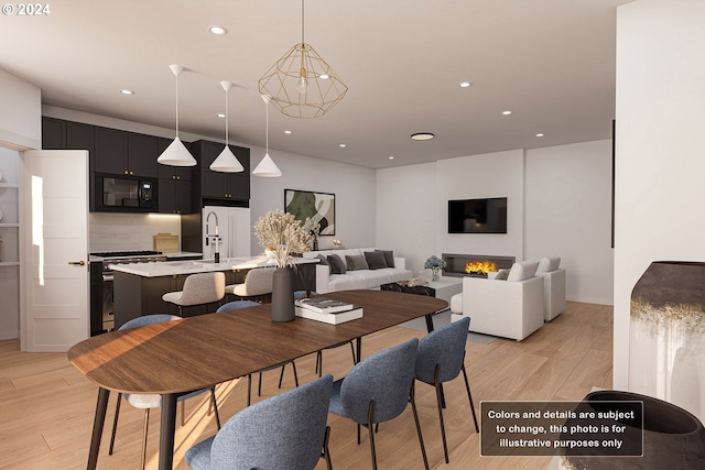 dining space featuring sink and light hardwood / wood-style floors