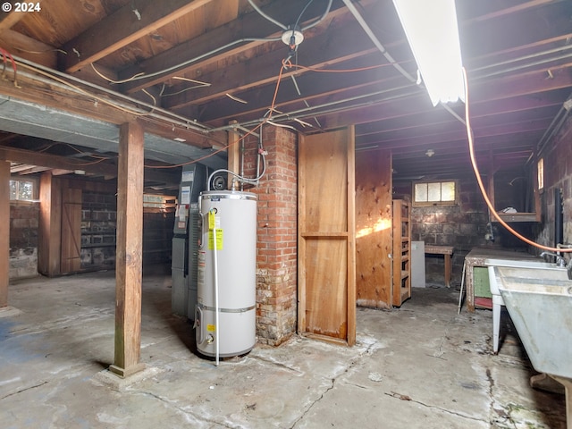 basement featuring sink and secured water heater