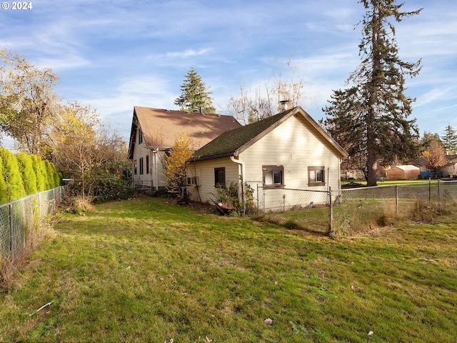 view of property exterior featuring a lawn