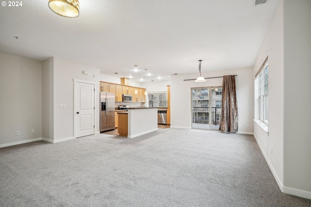 unfurnished living room with light carpet