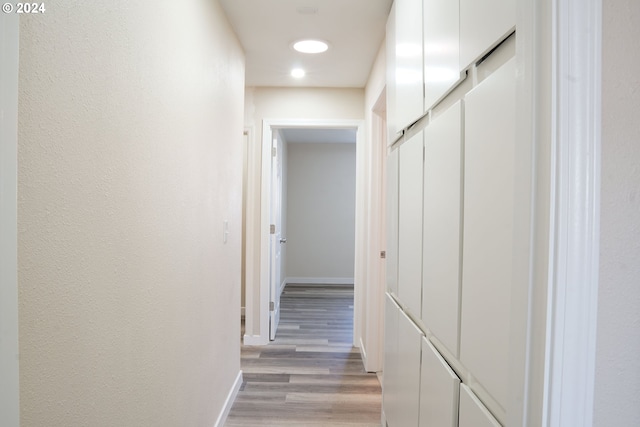 hallway with light wood-type flooring