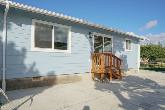 rear view of property featuring a patio