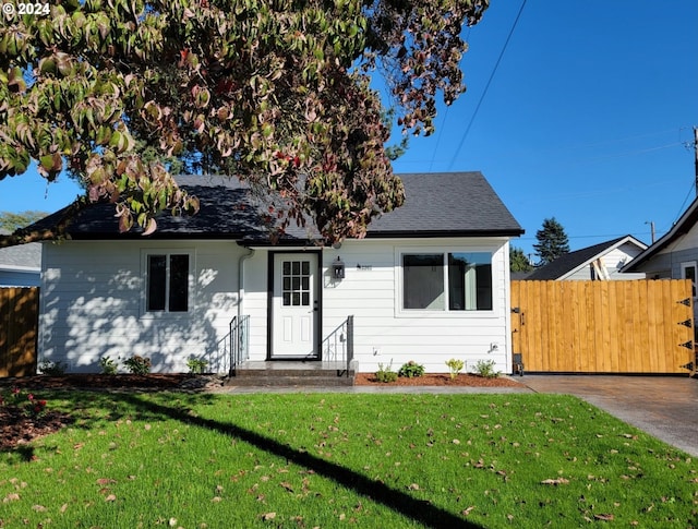 bungalow with a front lawn