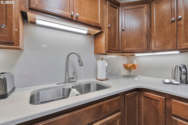 kitchen with tasteful backsplash and sink