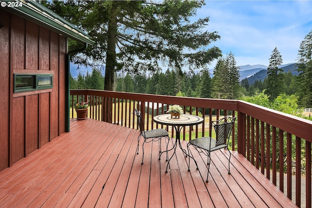 wooden deck with a mountain view