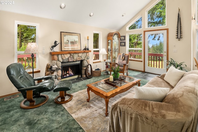 sitting room featuring a fireplace, carpet, and vaulted ceiling