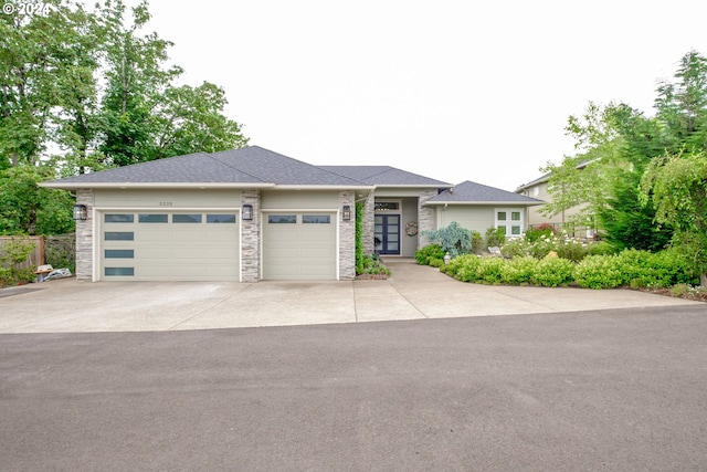 prairie-style house featuring a garage