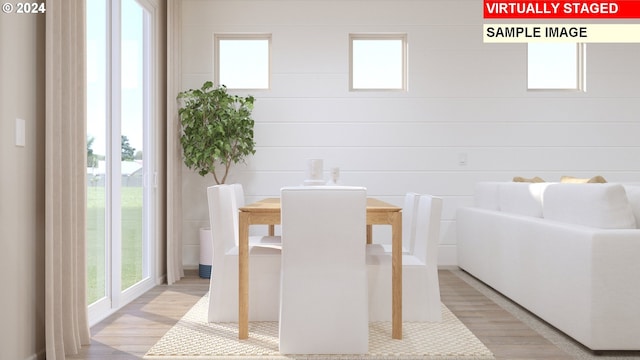 dining space featuring light hardwood / wood-style floors