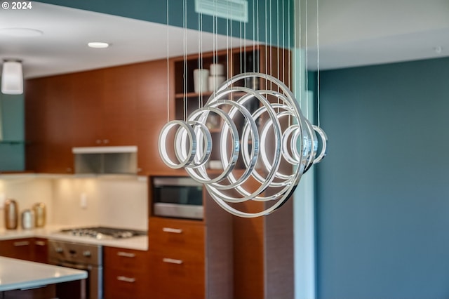 interior details with appliances with stainless steel finishes and ventilation hood