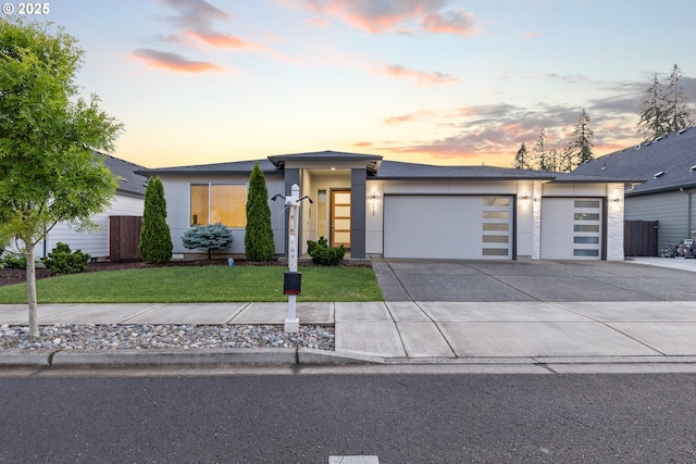 4012 SE 19th Ave, Brush Prairie, WA 98606 - view of front of house featuring a garage, a front yard, driveway, and stucco siding