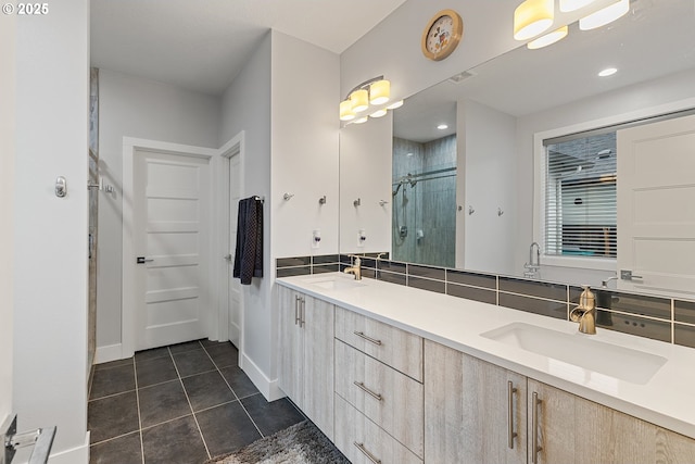 4012 SE 19th Ave, Brush Prairie, WA 98606 - bathroom with tile patterned floors, a stall shower, double vanity, and baseboards