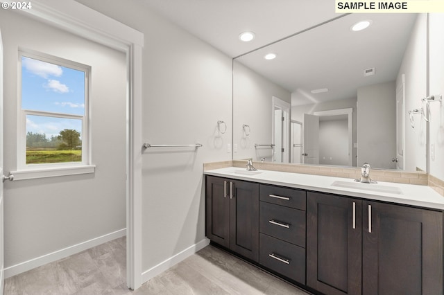 bathroom featuring vanity and hardwood / wood-style flooring