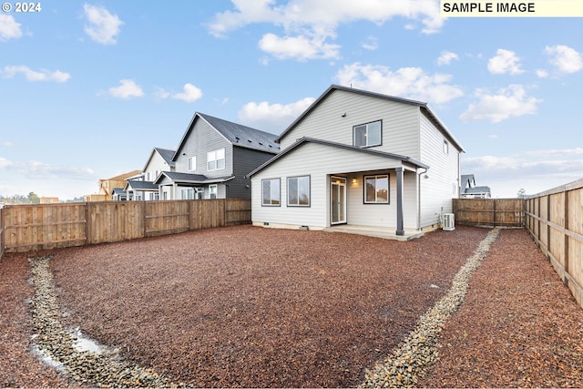 back of house featuring central AC unit