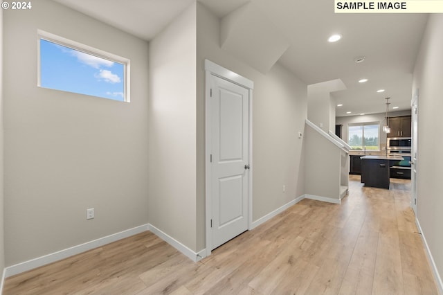 entrance foyer with light hardwood / wood-style flooring