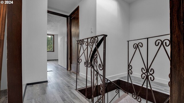 stairs featuring wood-type flooring