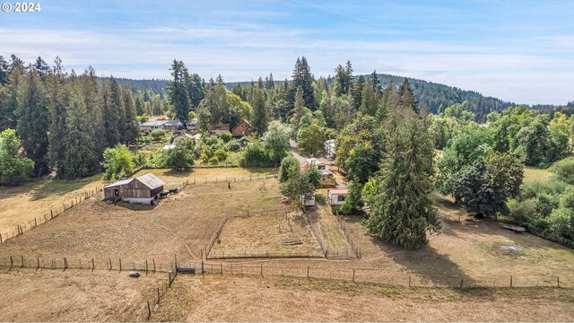 birds eye view of property featuring a rural view