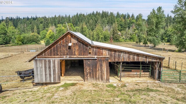 view of outbuilding featuring a rural view