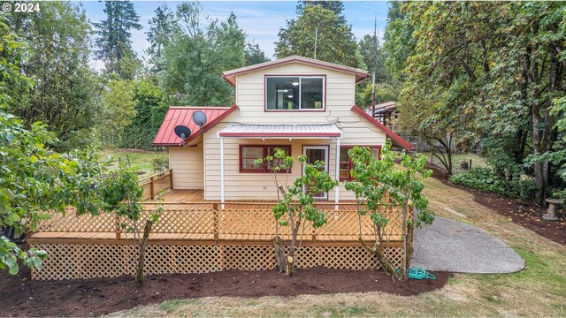 view of front of home with a wooden deck