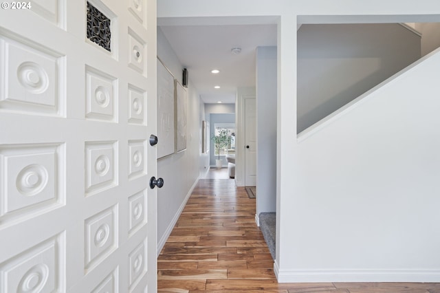 corridor featuring hardwood / wood-style floors