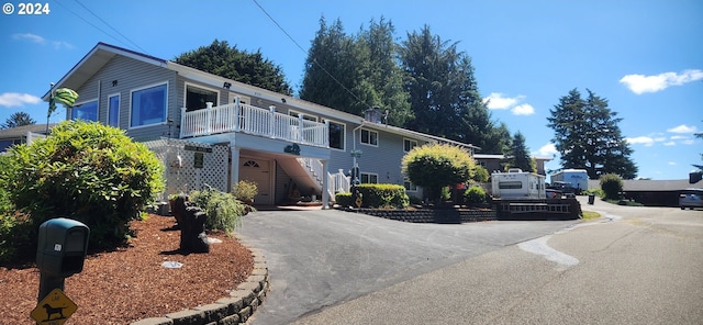 view of side of home featuring a balcony