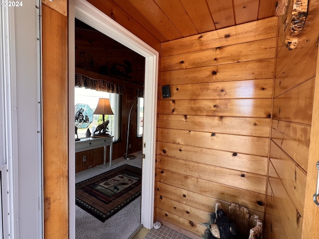 interior space with wooden ceiling and wooden walls