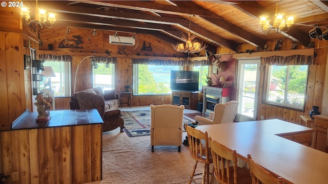 living room with vaulted ceiling with beams, plenty of natural light, wood ceiling, and a chandelier