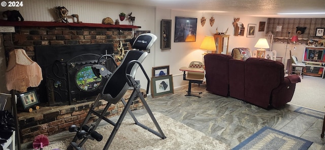 living room featuring a brick fireplace