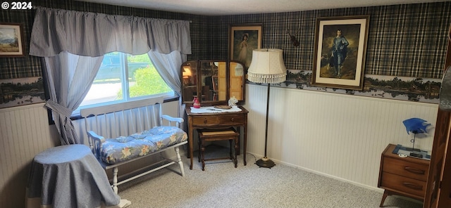 sitting room featuring carpet flooring