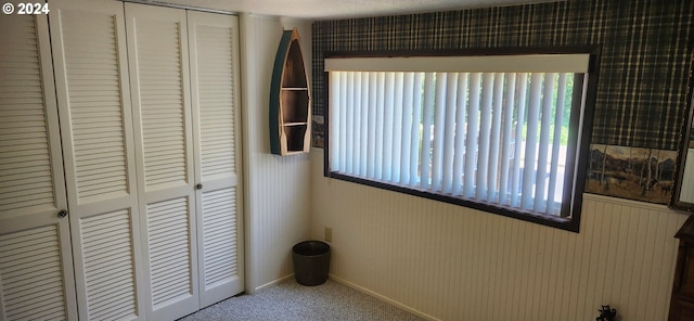 unfurnished bedroom featuring a closet and carpet