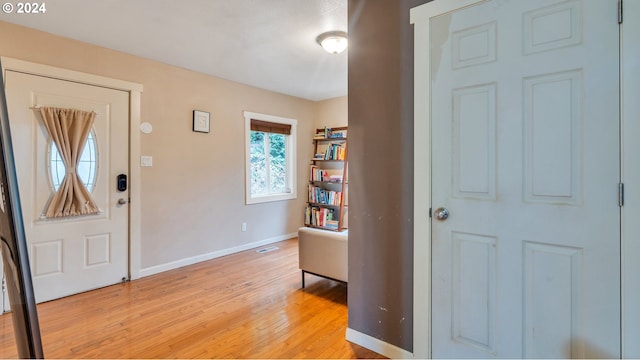 foyer entrance with light hardwood / wood-style flooring