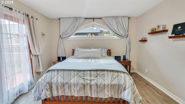 bedroom featuring light wood-type flooring