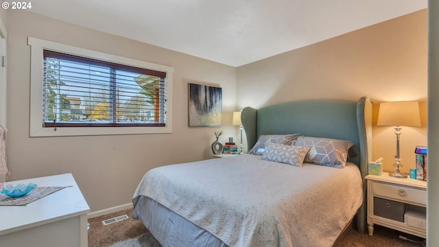 bedroom with dark carpet