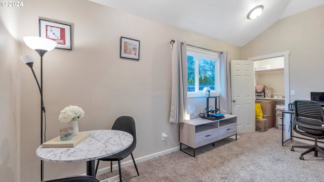 office area with light colored carpet and lofted ceiling