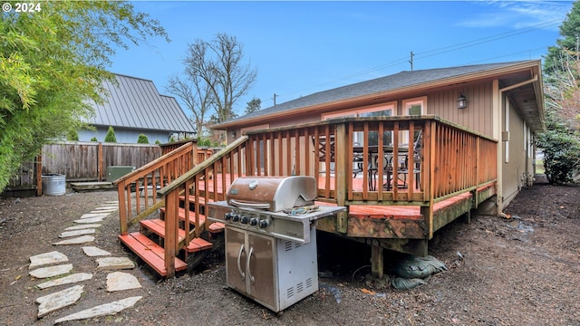 wooden terrace featuring grilling area