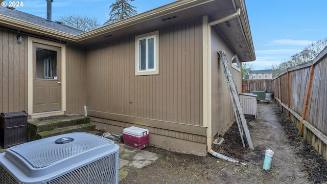 view of side of property with cooling unit