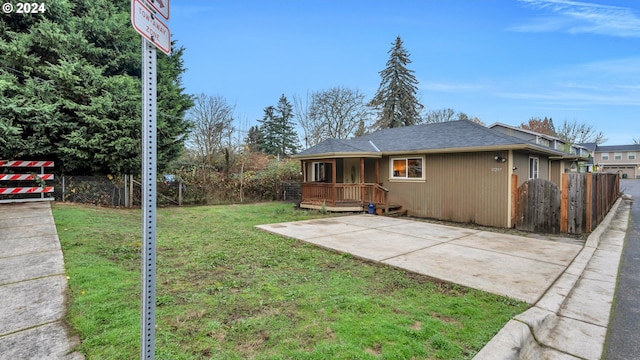 rear view of property with a lawn