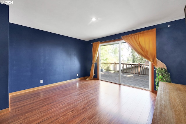 empty room featuring wood-type flooring