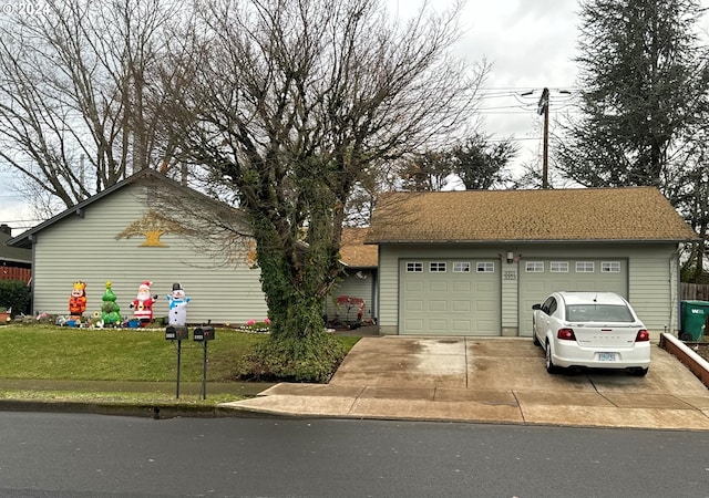 view of front facade with a garage and a front yard