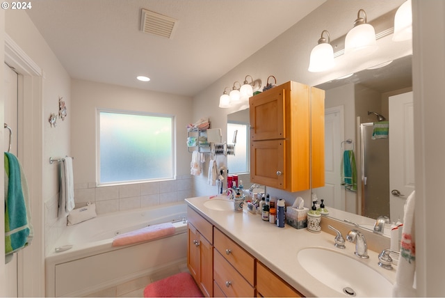 full bath with visible vents, tile patterned flooring, a shower with door, a bath, and a sink
