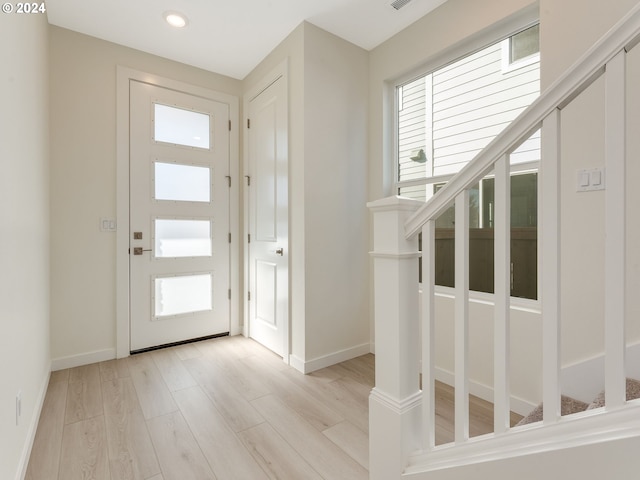 entrance foyer featuring light wood-type flooring