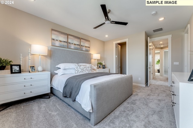 bedroom featuring light colored carpet, recessed lighting, baseboards, and visible vents