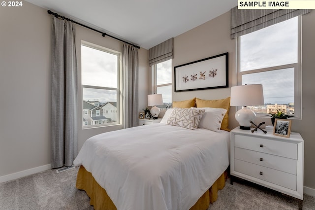 bedroom with light carpet