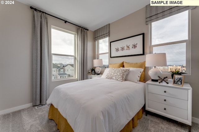 bedroom featuring carpet floors and baseboards